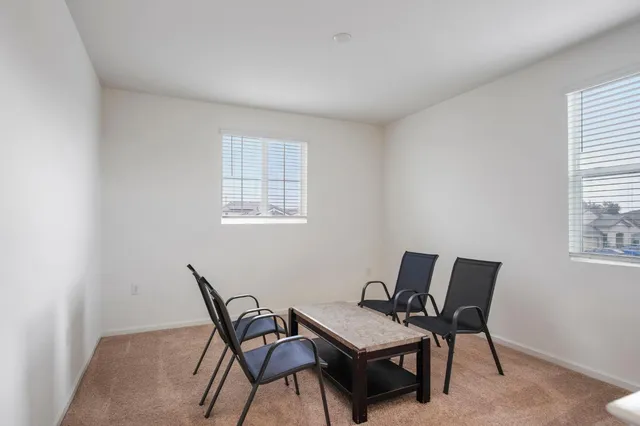 a work room with furniture and windows