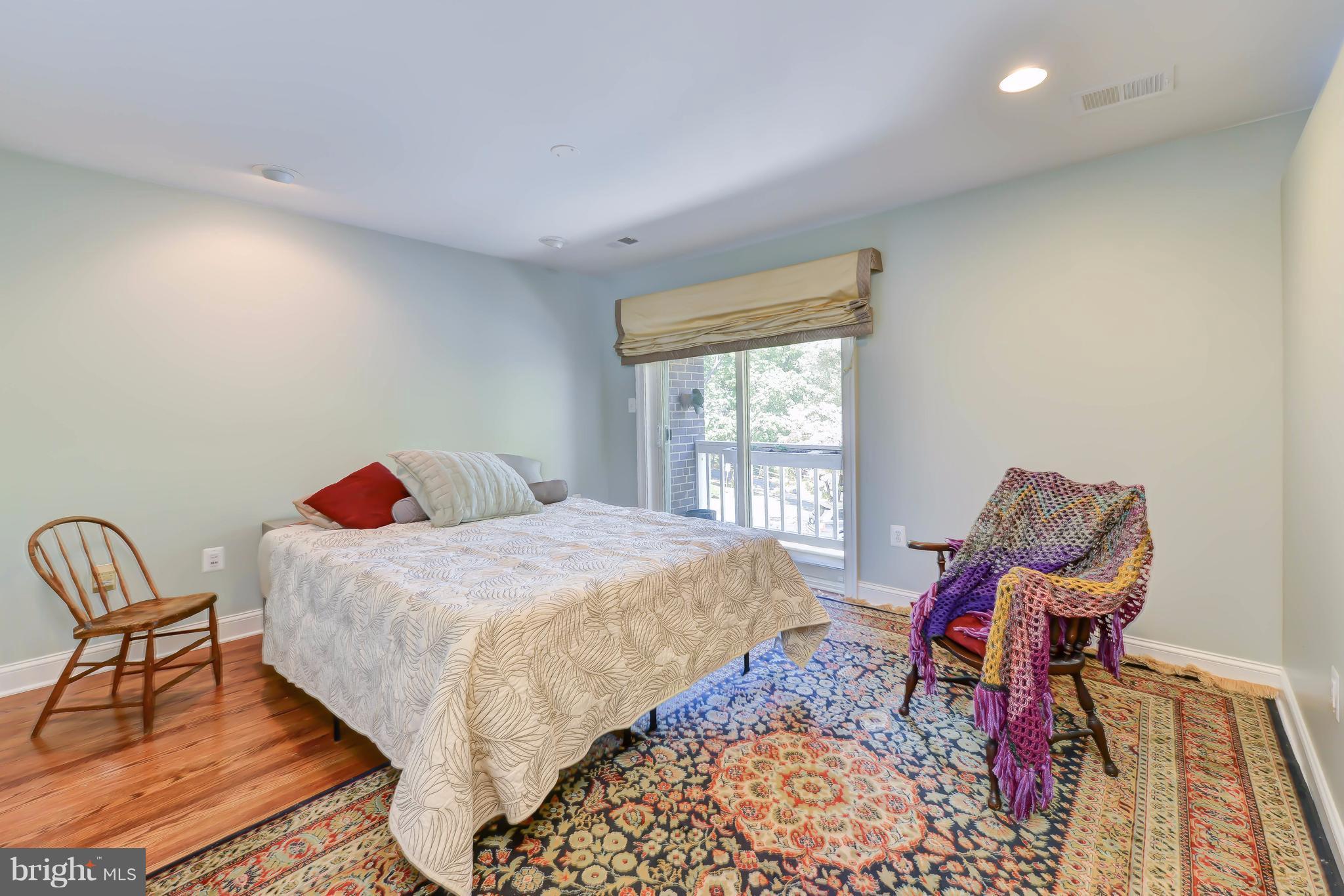 2126 Military Road Arlington, VA 22207 - Photo 20 of 29 a bedroom with a bed and chair