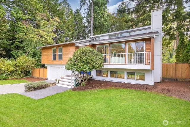 a view of a house with a backyard porch and sitting area
