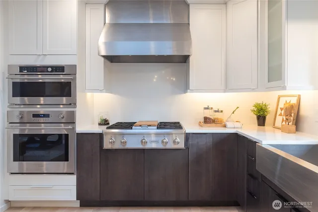 a kitchen with a stove and a sink