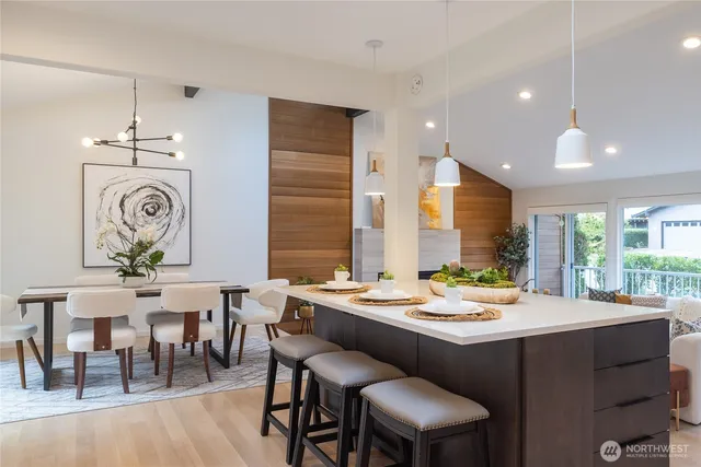 a dining room with furniture a window and a chandelier