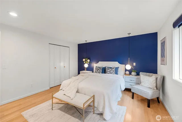 a spacious bedroom with a bed and a couch