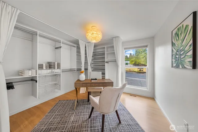 a view of a dining room with furniture and window