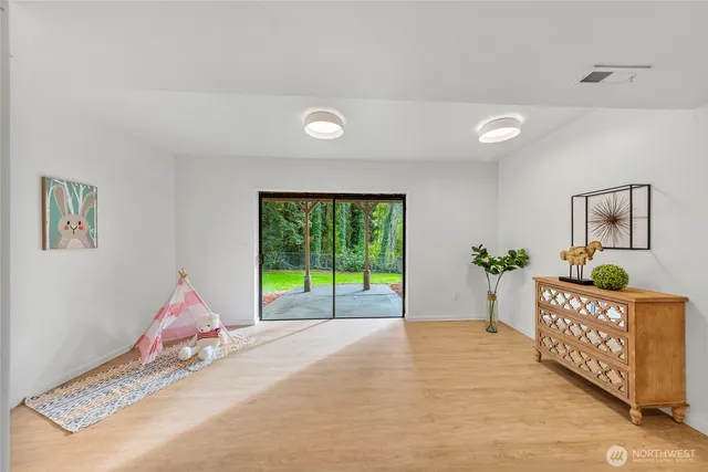 a bed room with a bed and a large window