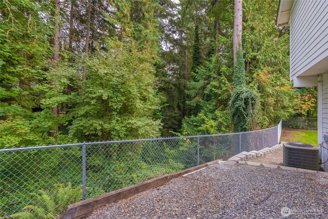 a view of a fence and a swing