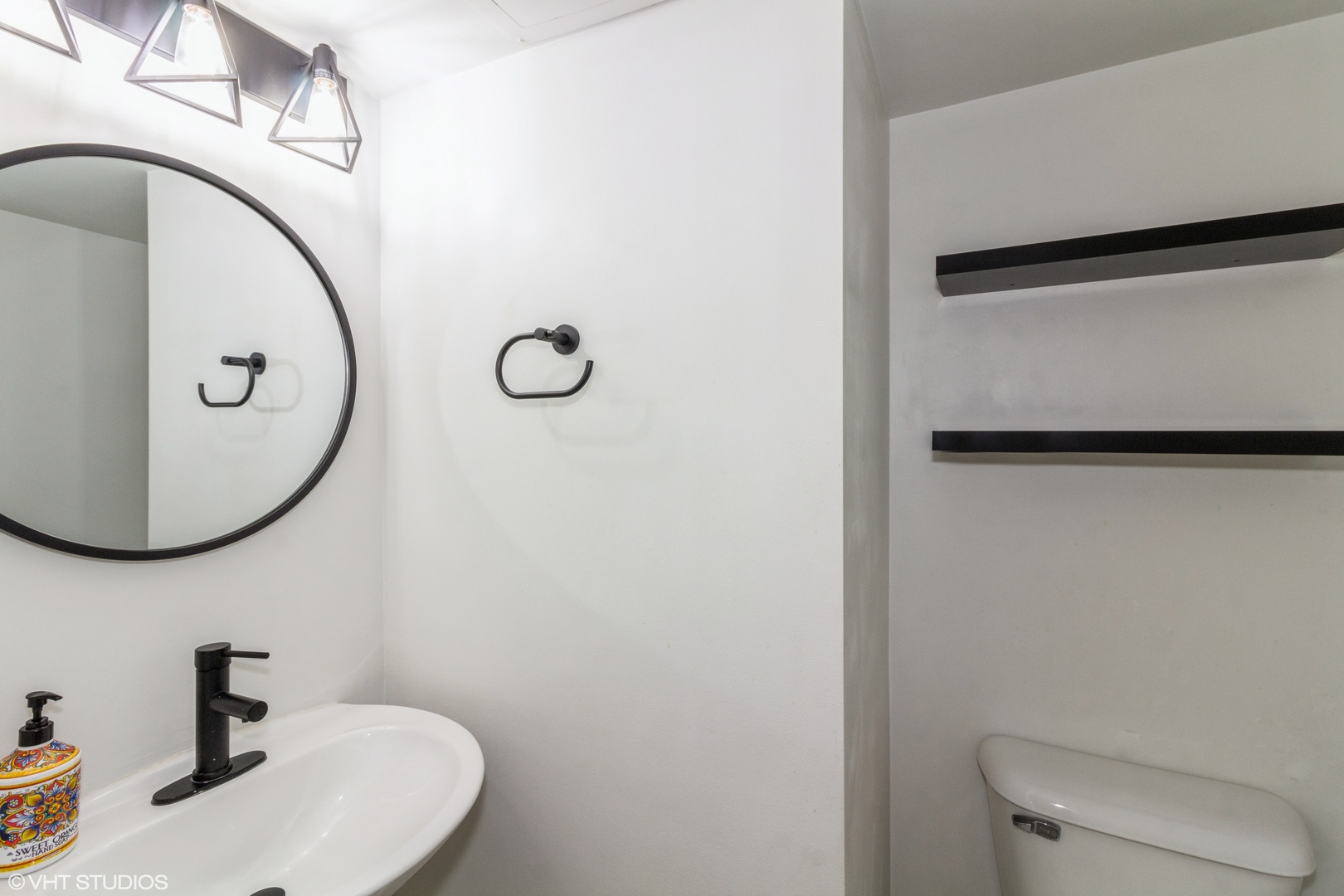 1061 Symphony Drive Aurora, IL 60504 - Photo 6 of 10 a bathroom with a toilet and a sink