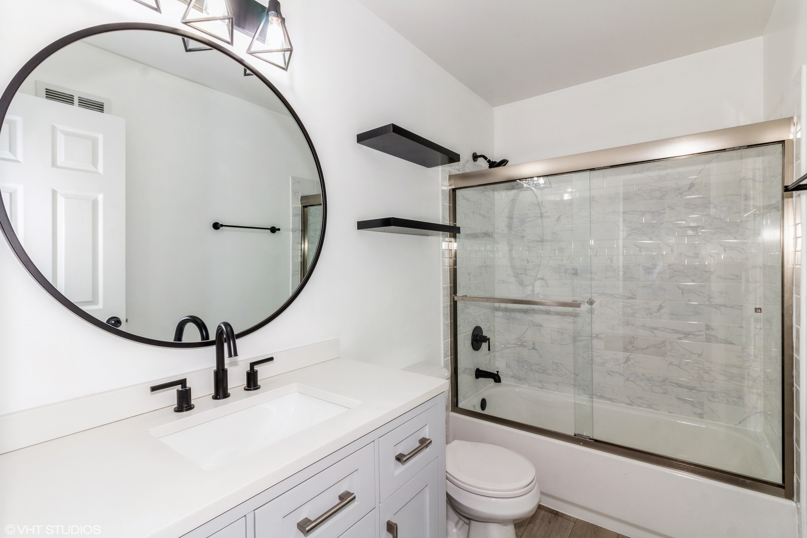 1061 Symphony Drive Aurora, IL 60504 - Photo 8 of 10 a bathroom with a sink a toilet and a mirror
