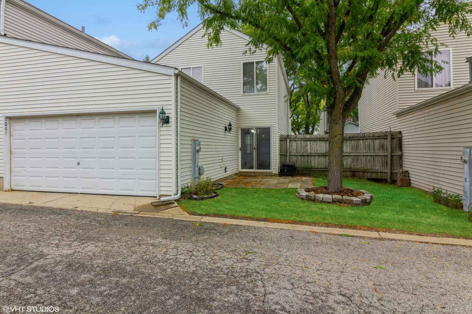 1061 Symphony Drive Aurora, IL 60504 - Photo 10 of 10 a front view of a house with garden