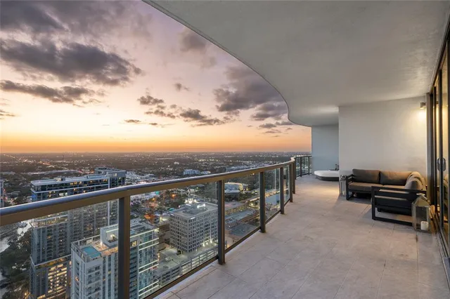 a view of a balcony with chairs