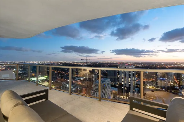 a view of a balcony with furniture
