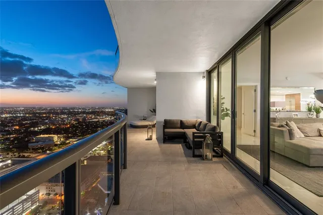 a view of a balcony with chairs