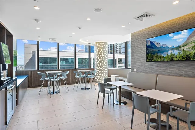 a view of a patio with couches and a fire pit