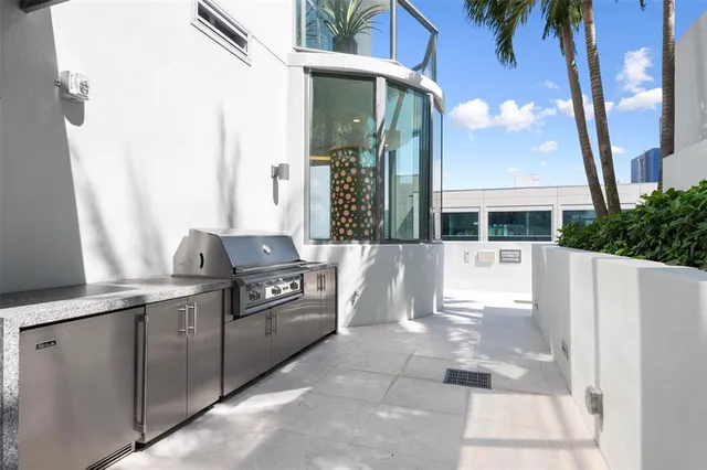 a swimming pool with outdoor seating and yard