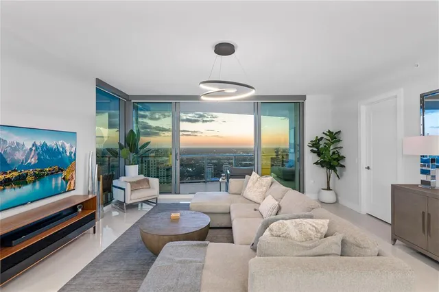 a large white kitchen with a large window