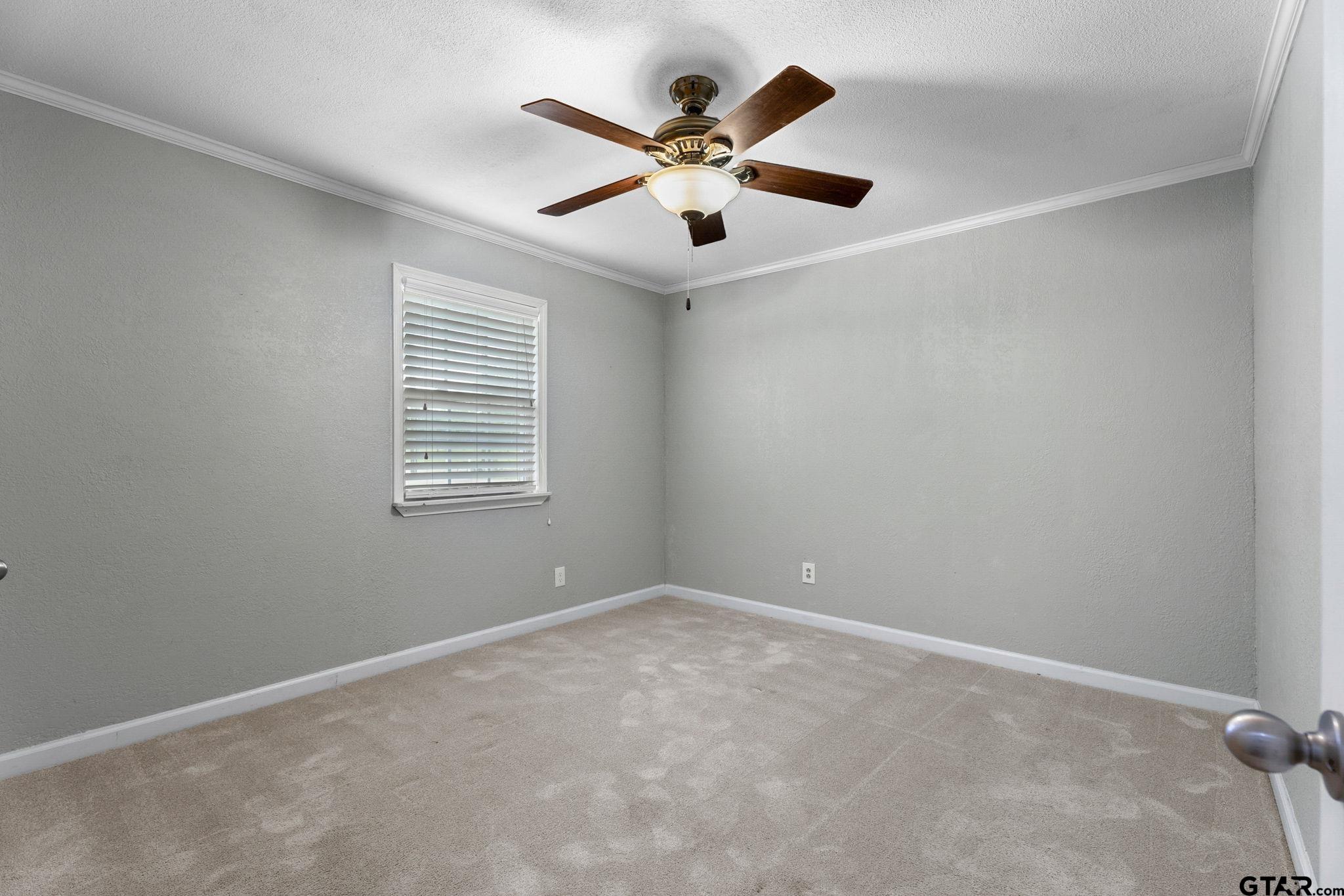 6091 Mockingbird Lane Murchison, TX 75778 - Photo 18 of 33 an empty room with ceiling fan and window
