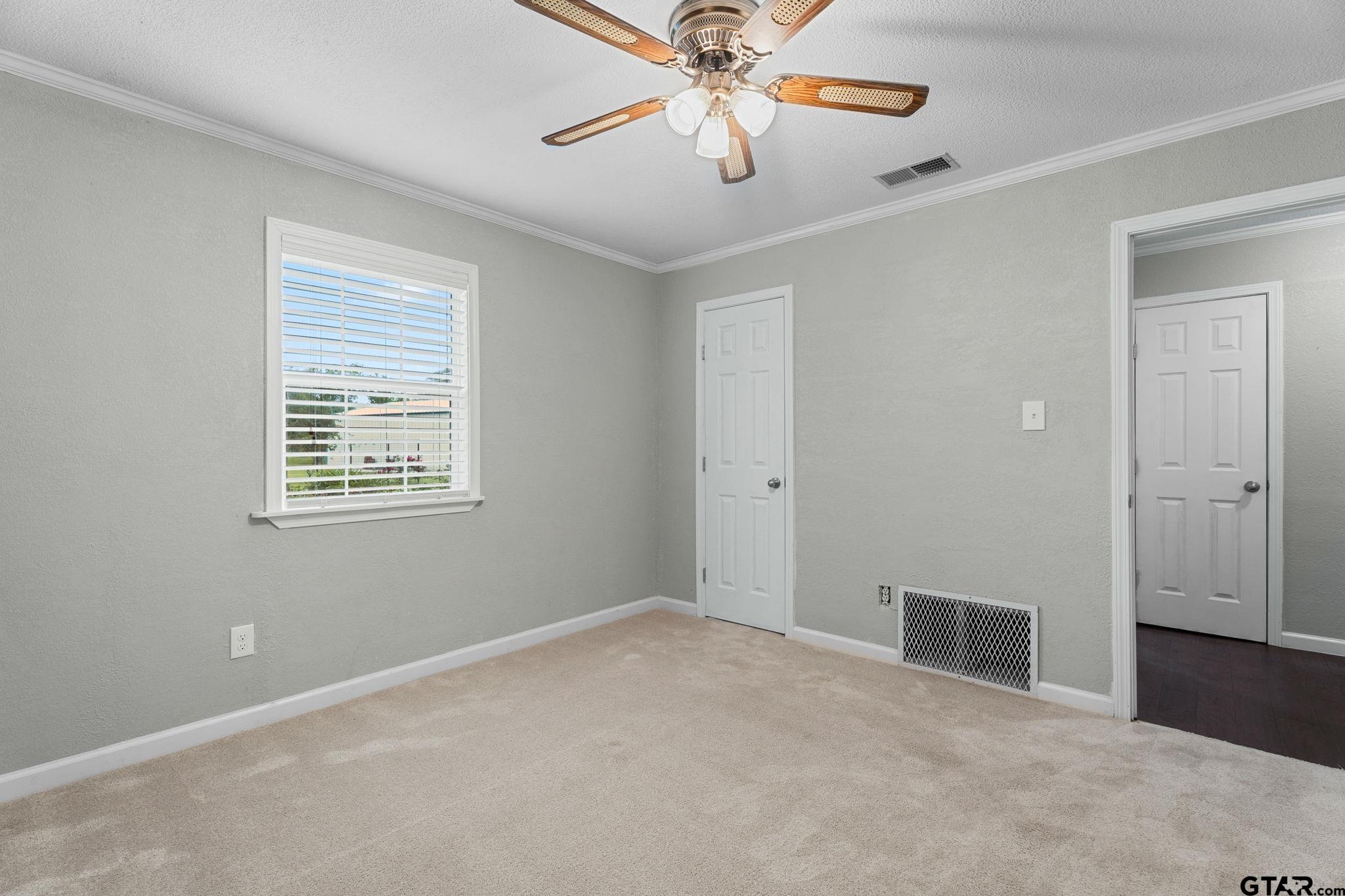 6091 Mockingbird Lane Murchison, TX 75778 - Photo 20 of 33 a view of an empty room with window and chandelier fan