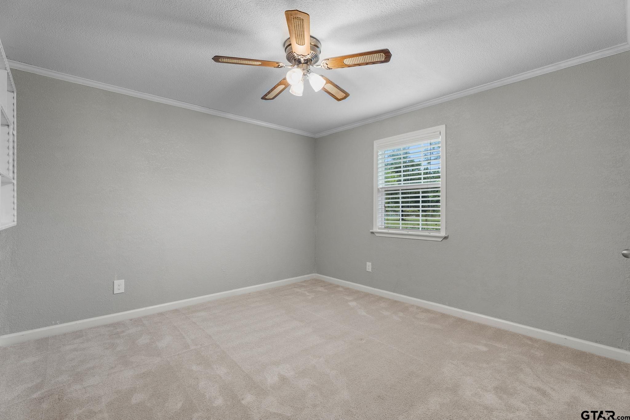 6091 Mockingbird Lane Murchison, TX 75778 - Photo 21 of 33 an empty room with windows and ceiling fan