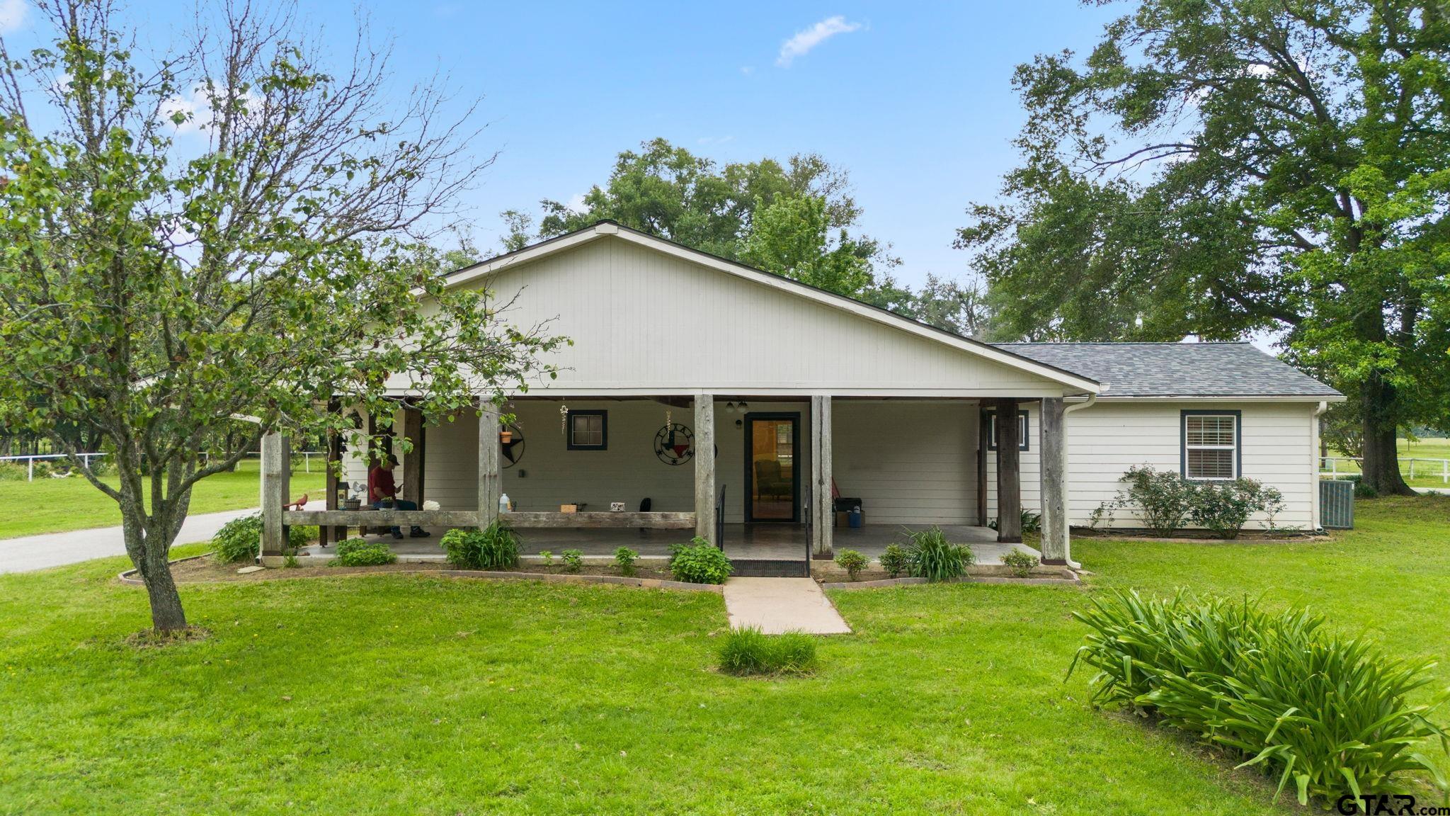 6091 Mockingbird Lane Murchison, TX 75778 - Photo 23 of 33 a front view of house with yard and green space