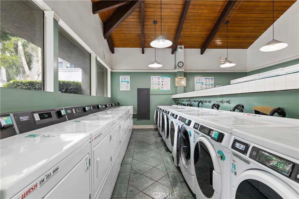20134 Leadwell Street, Unit 332 Winnetka, CA 91306 - Photo 13 of 14 a utility room with dryer and washer