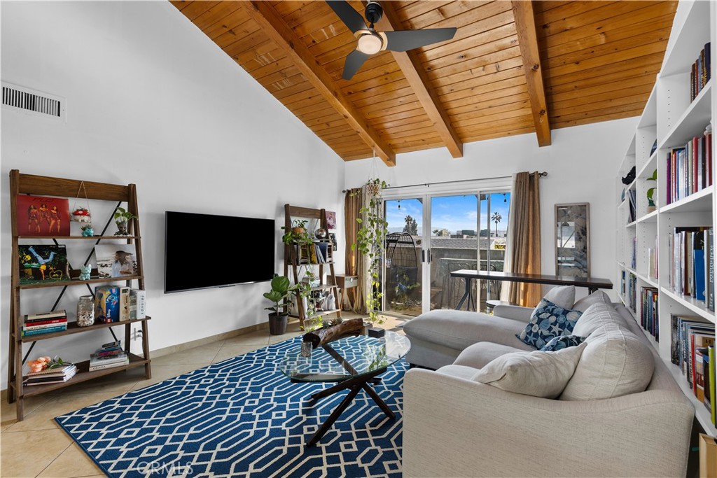 20134 Leadwell Street, Unit 332 Winnetka, CA 91306 - Photo 2 of 14 a living room with furniture and a flat screen tv