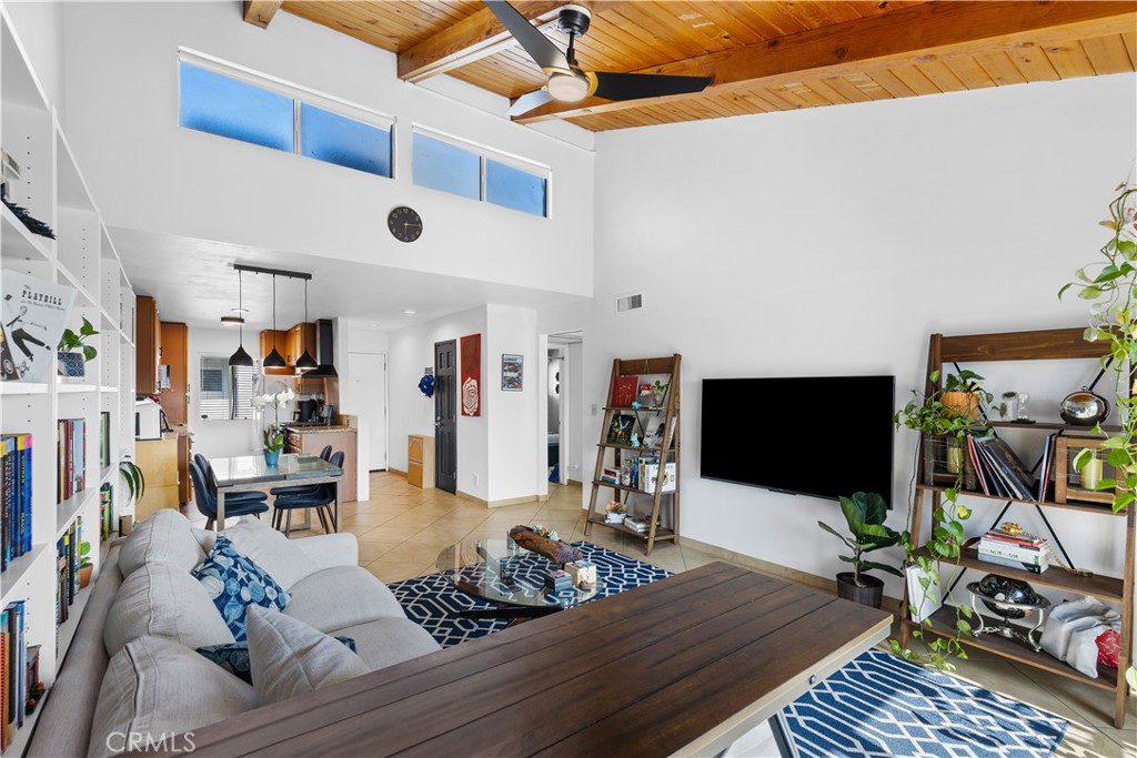 20134 Leadwell Street, Unit 332 Winnetka, CA 91306 - Photo 4 of 14 a living room with furniture and a flat screen tv
