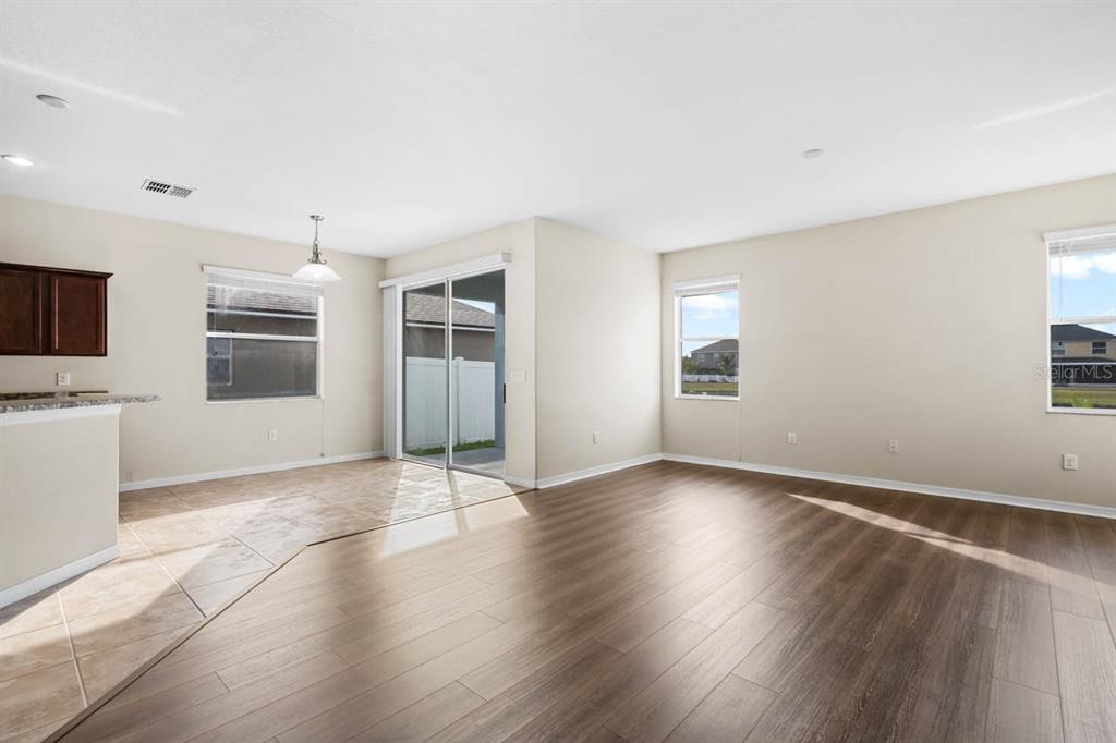 1504 Oak Pond Street Ruskin, FL 33570 - Photo 13 of 76 a view of an empty room with a window and wooden floor