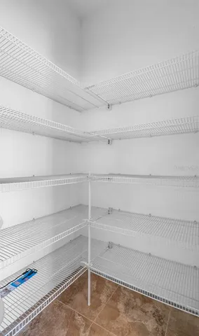 a view of a big room with closet and windows