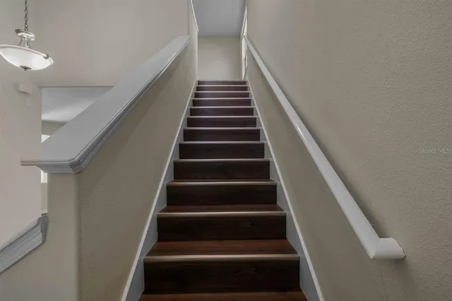 a view of a room with shelf on the wall