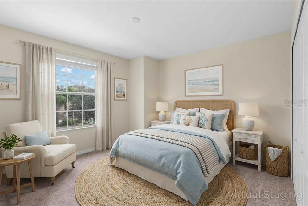 1504 Oak Pond Street Ruskin, FL 33570 - Photo 32 of 76 a bedroom with a bed and a couch