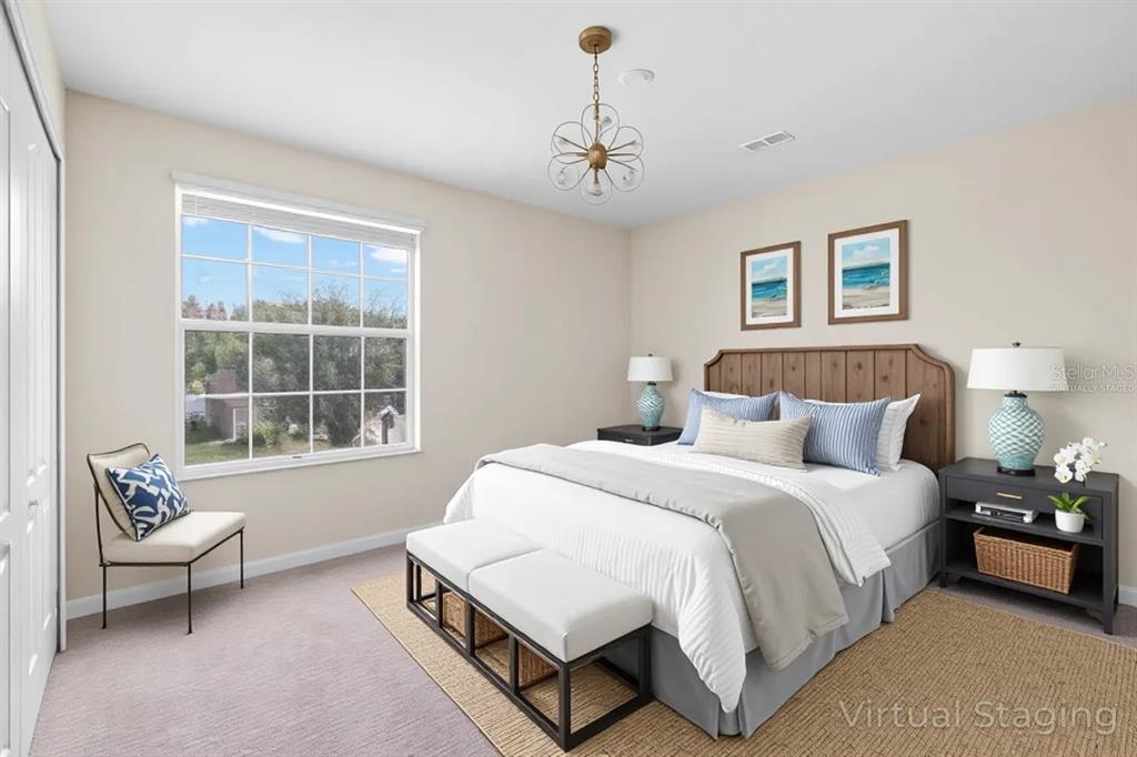 1504 Oak Pond Street Ruskin, FL 33570 - Photo 34 of 76 a spacious bedroom with a bed and window