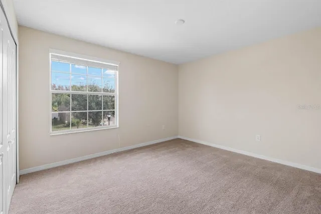 a view of a lake with houses in the back