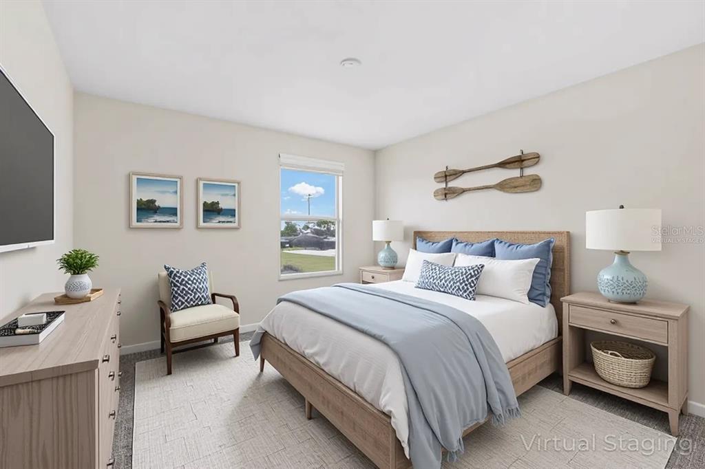 1504 Oak Pond Street Ruskin, FL 33570 - Photo 37 of 76 a bedroom with a bed and a couch