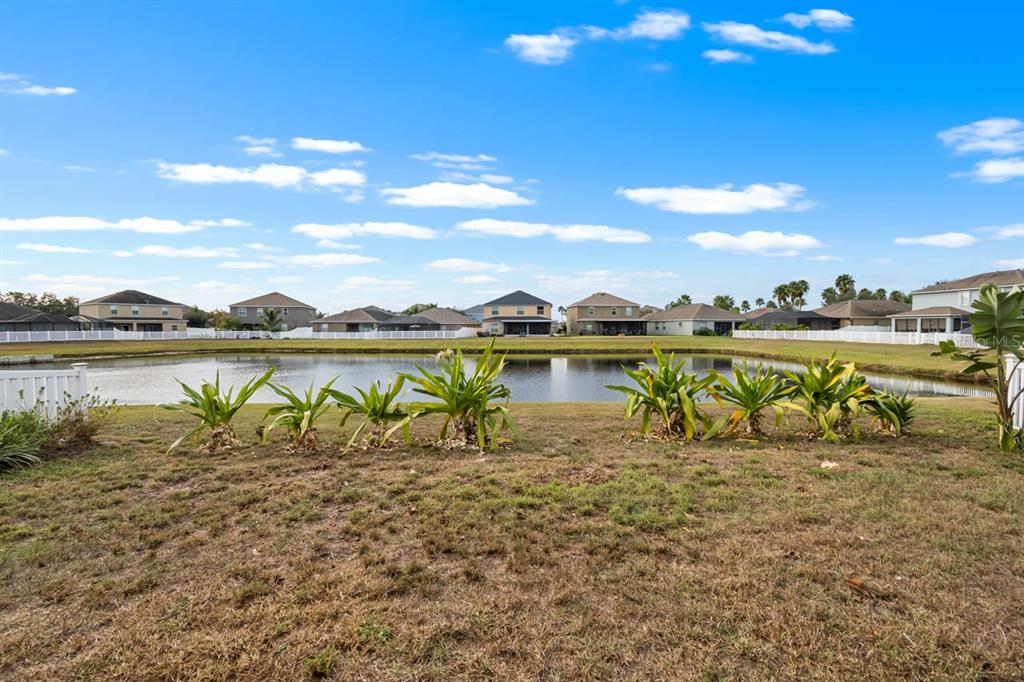 1504 Oak Pond Street Ruskin, FL 33570 - Photo 46 of 76 a view of a lake with houses in the background