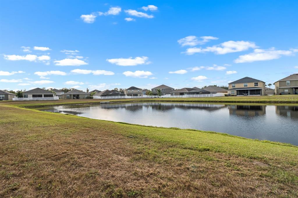 1504 Oak Pond Street Ruskin, FL 33570 - Photo 47 of 76 a view of a lake with houses in the back