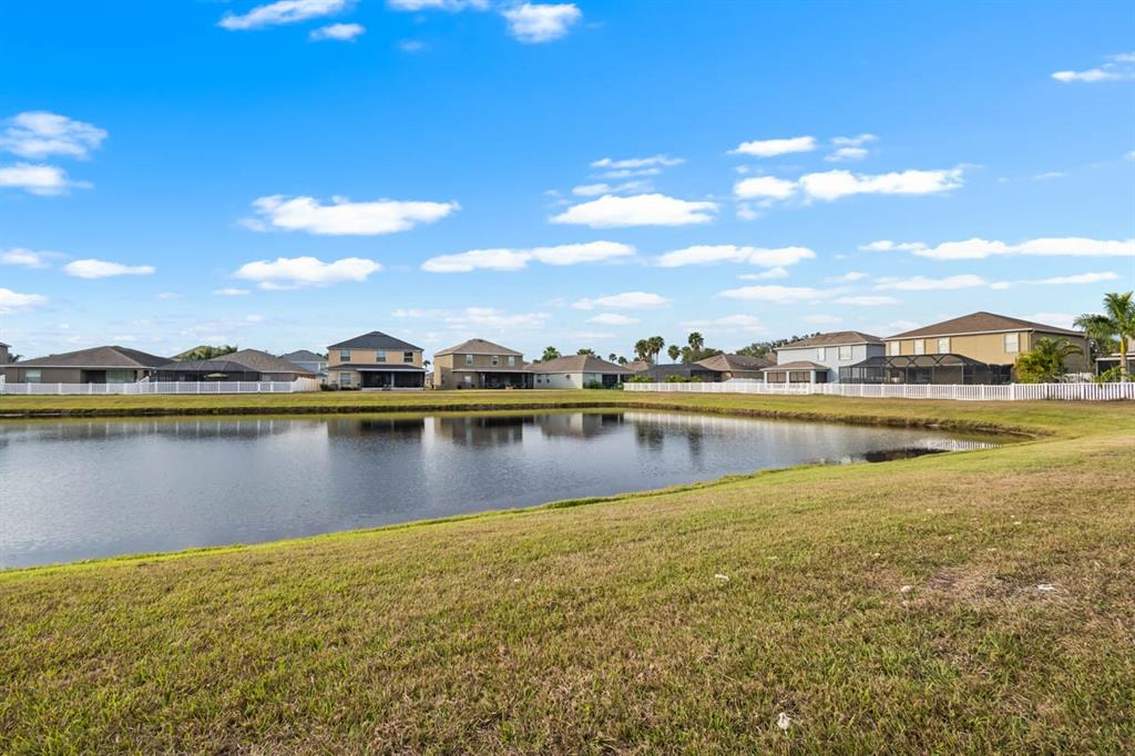 1504 Oak Pond Street Ruskin, FL 33570 - Photo 48 of 76 a view of a lake with houses in the background