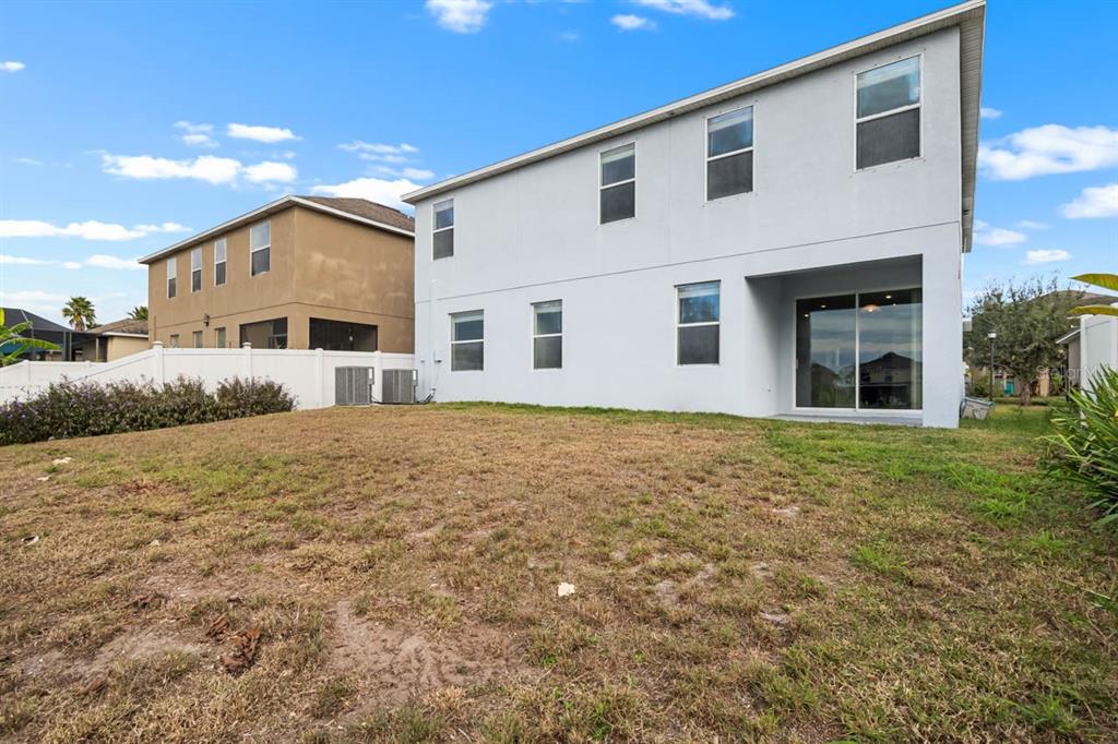 1504 Oak Pond Street Ruskin, FL 33570 - Photo 49 of 76 a front view of a house with a yard