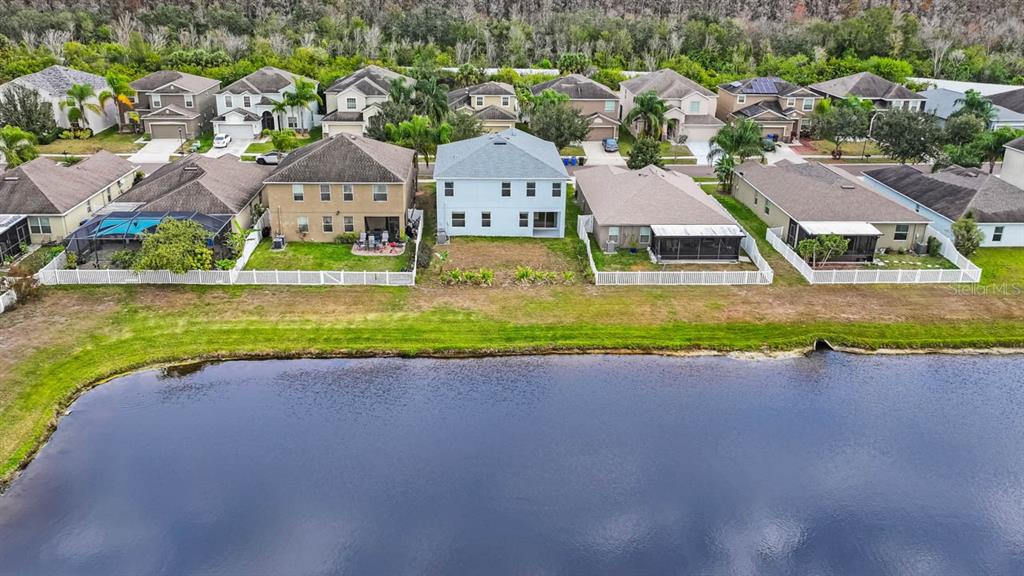 1504 Oak Pond Street Ruskin, FL 33570 - Photo 58 of 76 an aerial view of residential houses with outdoor space and parking