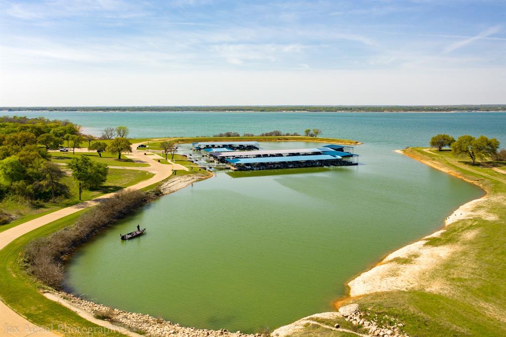 1324 Cobblestone Trail Whitney, TX 76692 - Photo 8 of 12 a view of a lake with a city