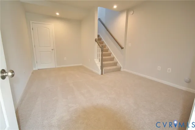 a view of an empty room with stairs