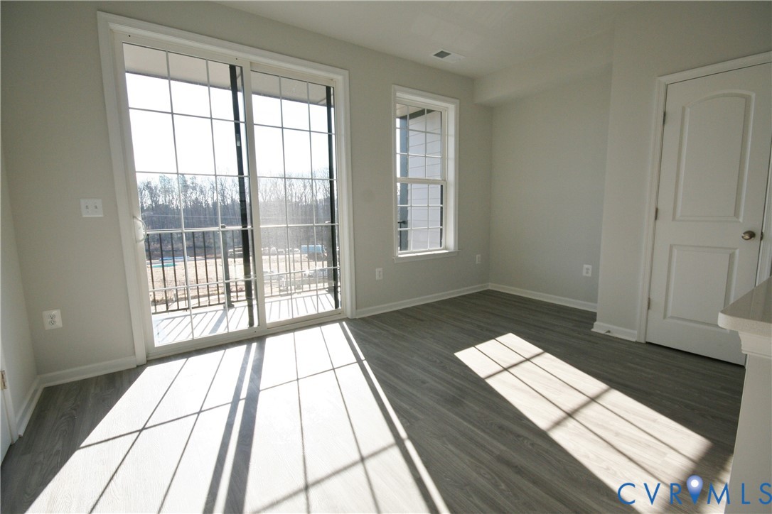 13226 Coalfield Station Lane Midlothian, VA 23114 - Photo 7 of 35 a view of wooden floor in a room next to a window
