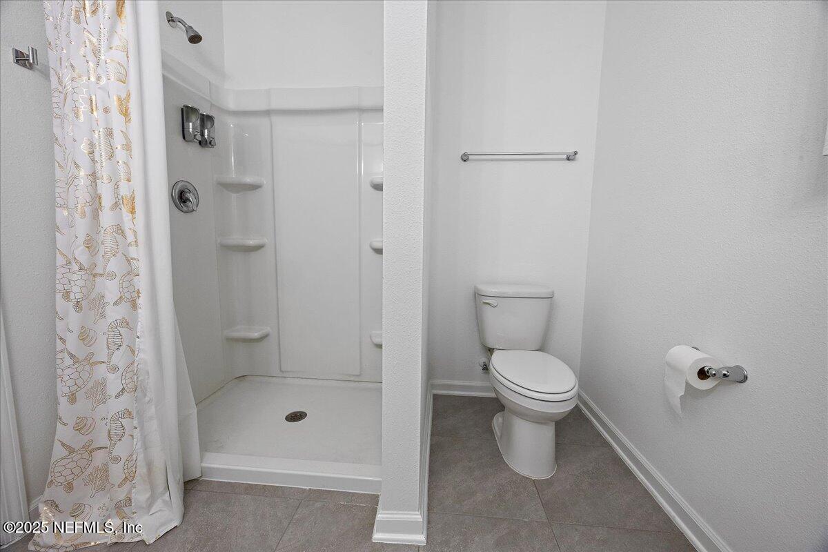 48 Barley Street St. Augustine, FL 32092 - Photo 14 of 24 a bathroom with a toilet and shower