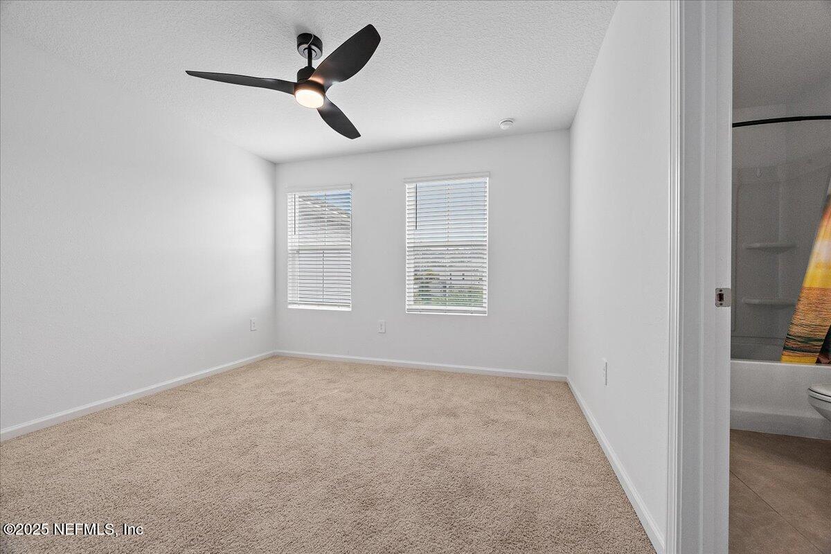 48 Barley Street St. Augustine, FL 32092 - Photo 16 of 24 a view of a livingroom with a ceiling fan and window