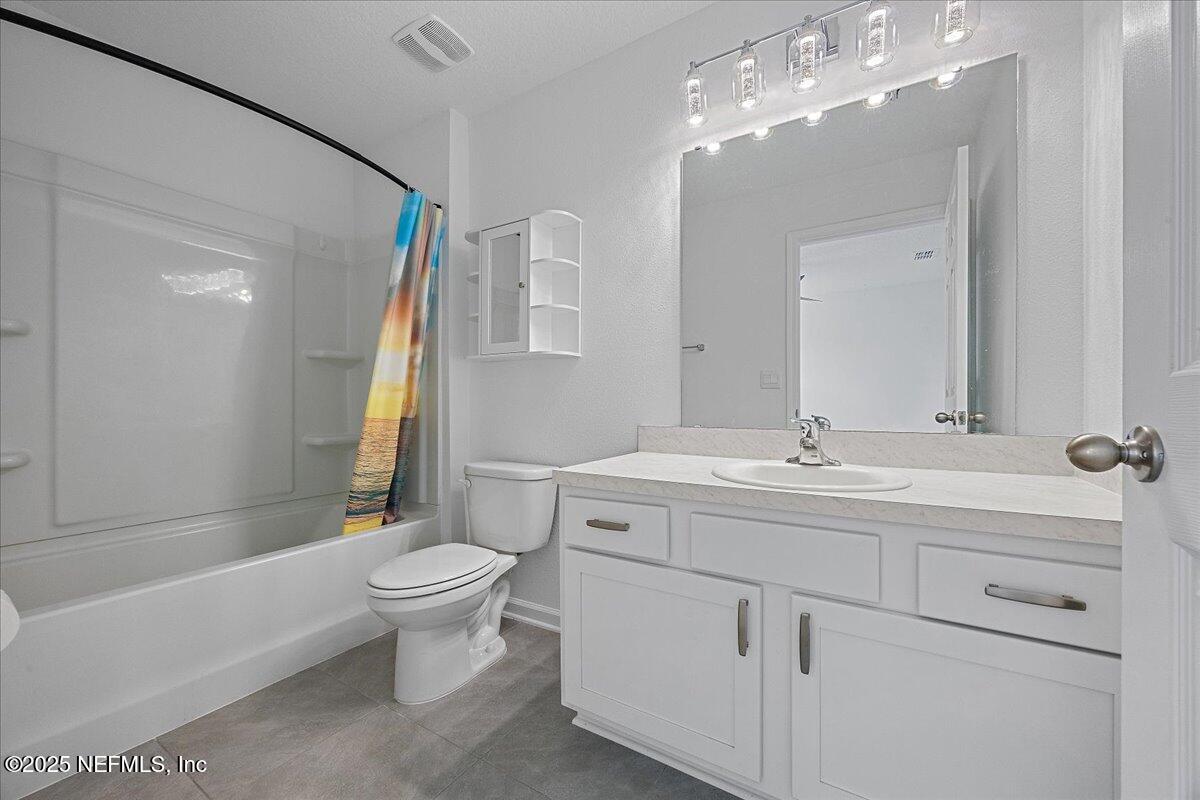 48 Barley Street St. Augustine, FL 32092 - Photo 17 of 24 a bathroom with a toilet sink and mirror