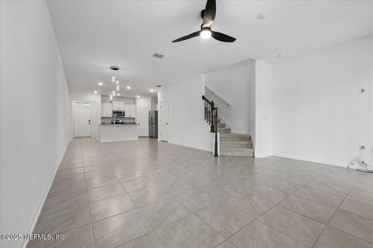 48 Barley Street St. Augustine, FL 32092 - Photo 6 of 24 a view of a livingroom with furniture and a ceiling fan