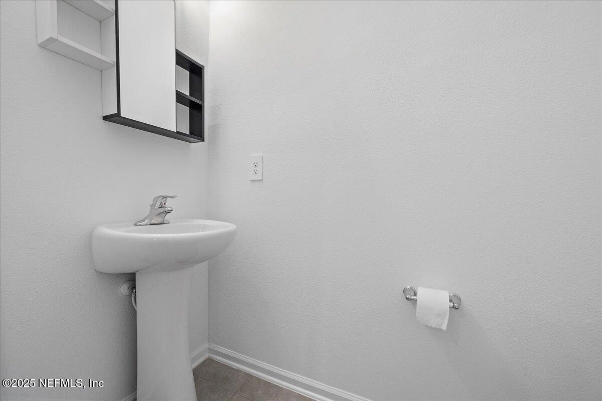 48 Barley Street St. Augustine, FL 32092 - Photo 7 of 24 a bathroom with a sink and mirror