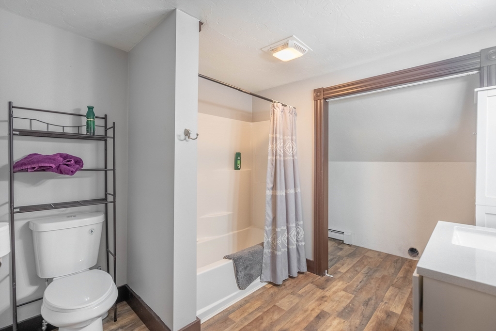 85 East Main Street, Unit 3 West Brookfield, MA 01585 - Photo 14 of 25 a bathroom with a toilet and a shower