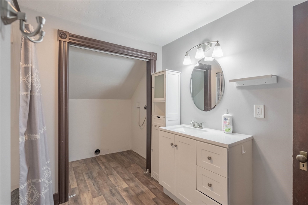 85 East Main Street, Unit 3 West Brookfield, MA 01585 - Photo 15 of 25 a bathroom with a double vanity sink mirror and shower