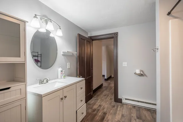 a bathroom with a sink and a mirror