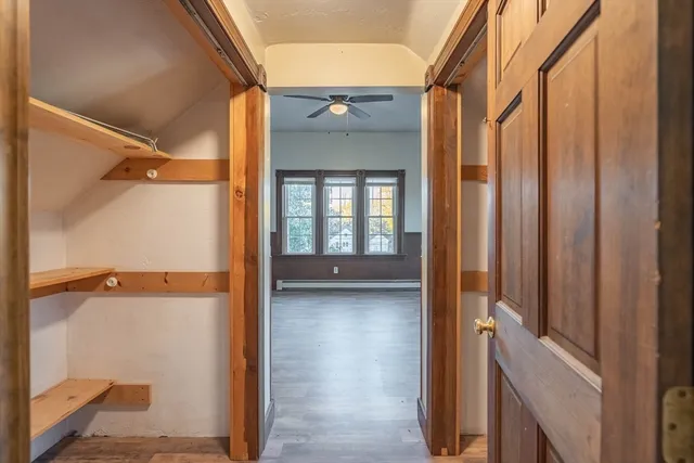 a view of a walk in closet and bedroom