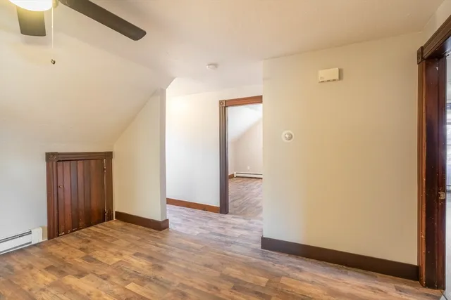 a view of a livingroom with wooden floor and closet